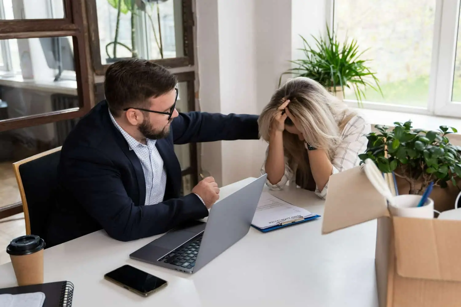 A roll-over accident victim receiving advice from a lawyer about what damages she can claim after a roll-over crash.